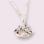 Load image into Gallery viewer, Rabbit jumping over the moon pendant in sterling silver. #mm rose colored zircon gemstone.
