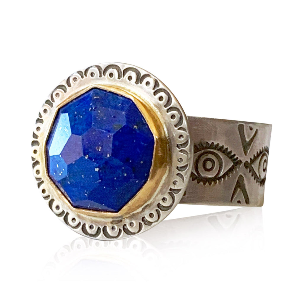 Lovely rose cut Lapis Lazuli ring with an 18K gold bezel.

This ring has a 12mm round, rose cut gemstone surrounded by solid 18K yellow gold on a sterling silver base and shank.
size 9.5
