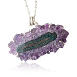 Load image into Gallery viewer, The natural crystal structure is a deep purple with a greenish middle circle. 

The stone itself is about 2" x 1" and comes on a sterling silver chain that can be worn at 16" or 18". Handmade hook and eye clasp.
