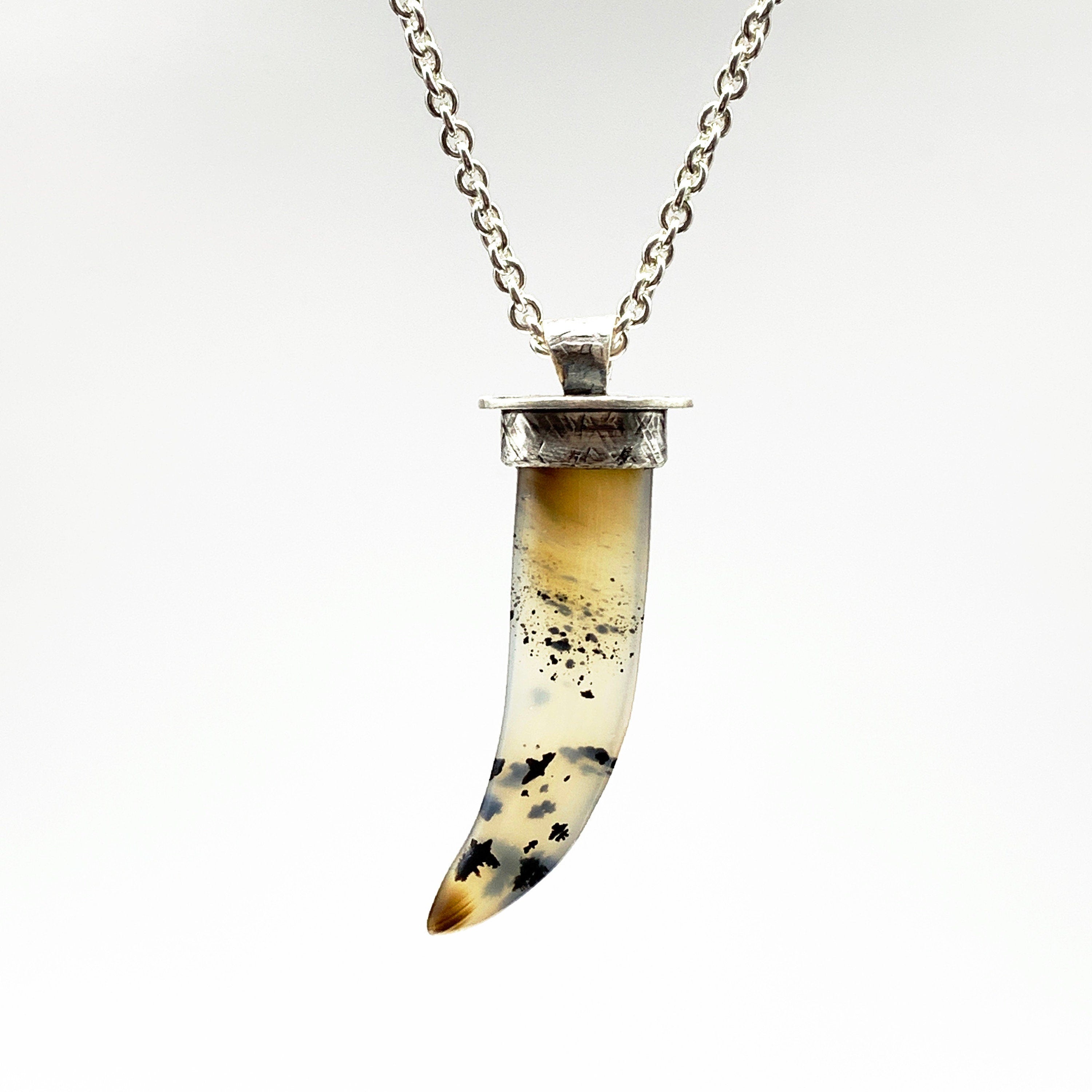 Beautiful Montana Agate pendant. This tooth or claw shaped stone is set in chunky silver with an interior post for security. It comes on a super thick sterling silver chain.