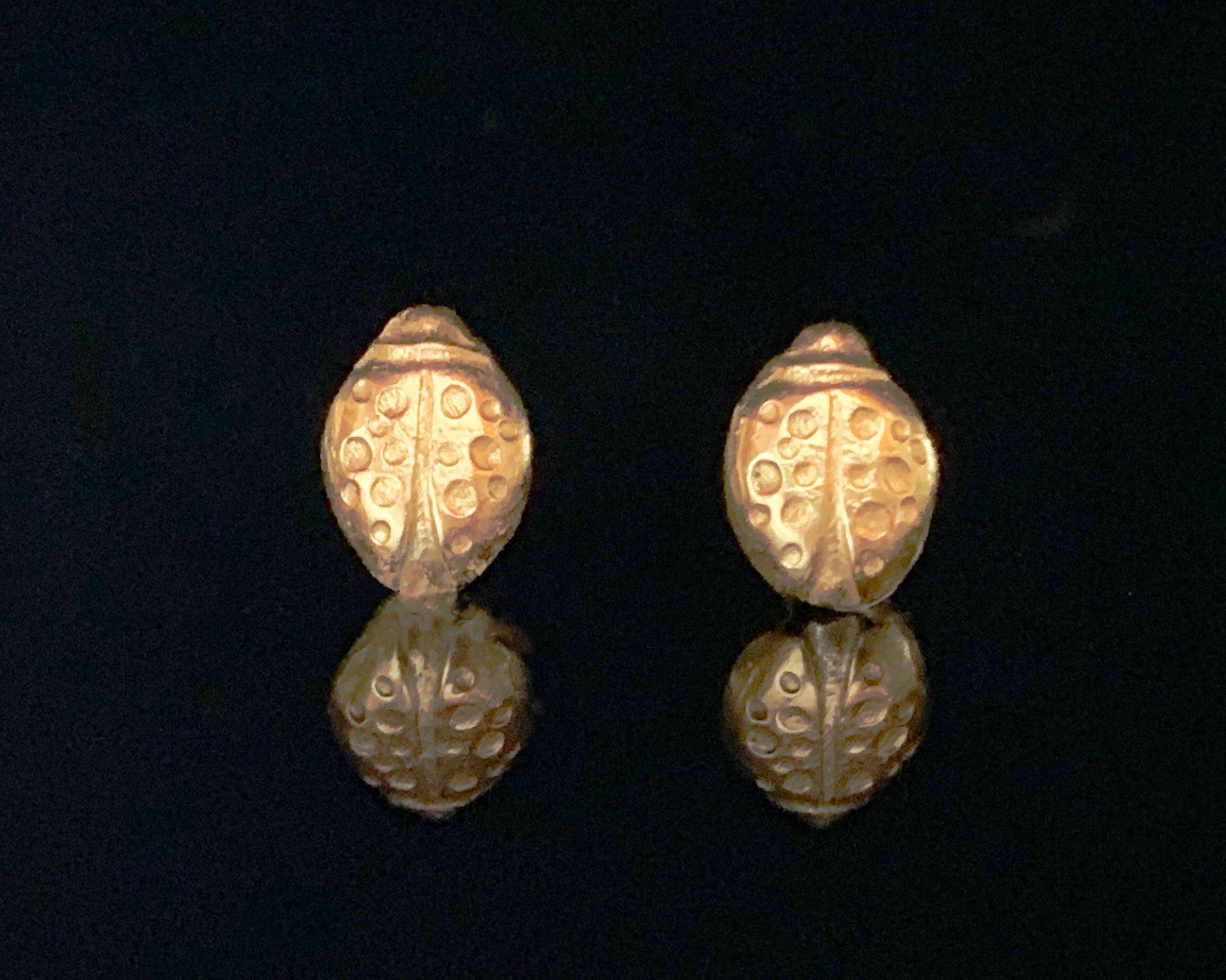 Gold ladybug stud earrings. Can be made in 14K and 18K gold. By Juju By Sarah.
