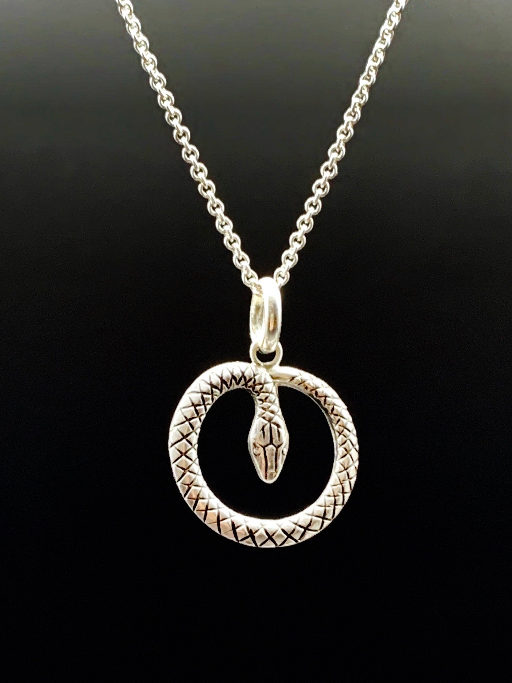 Snake pendant in sterling silver. Die stuck snake creates a circle in solid sterling silver. Vintage die!