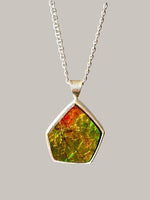 Load image into Gallery viewer, Geometric Ammonite pendant in Sterling Silver, iridescent green

