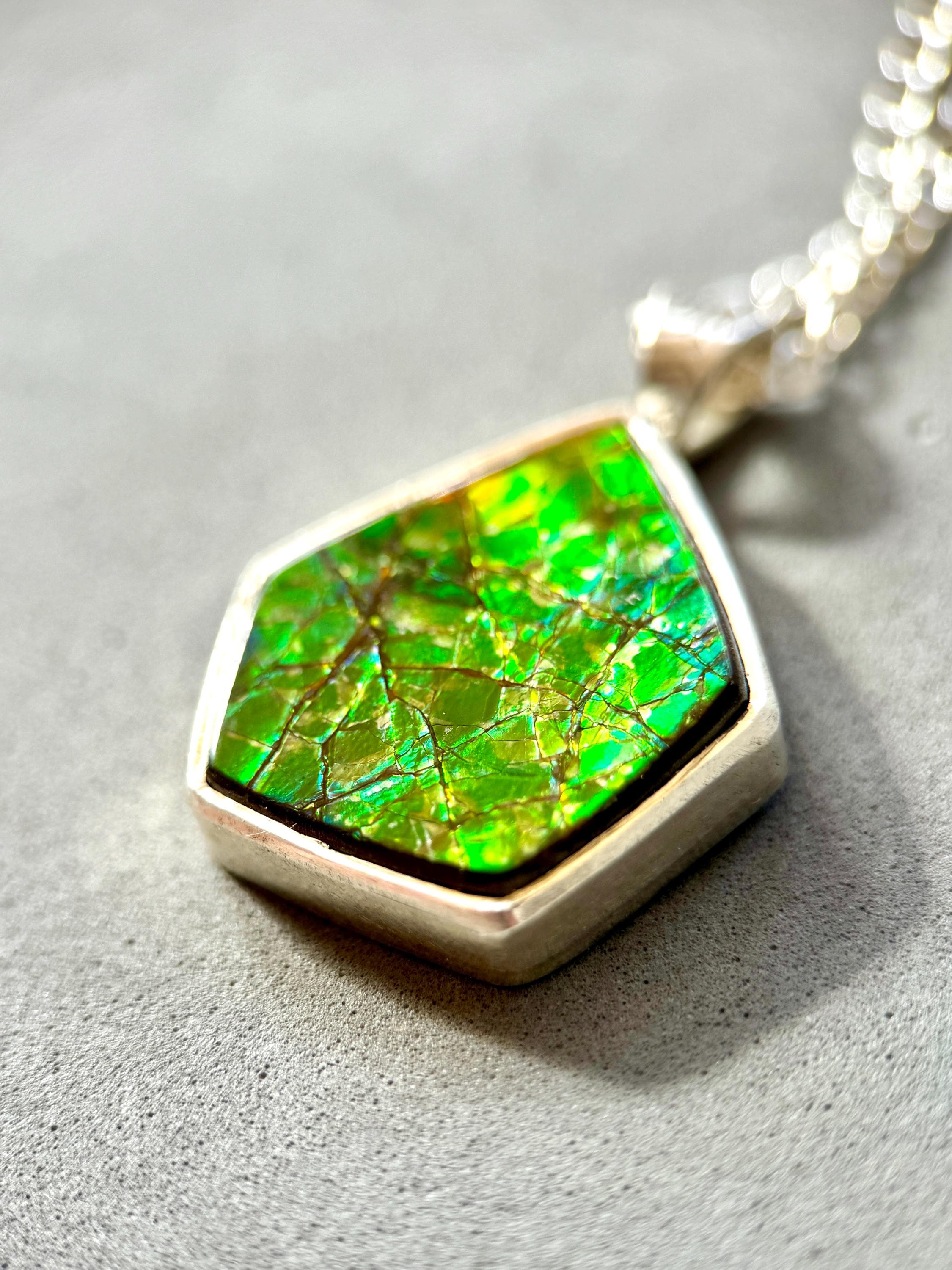 Geometric Ammonite pendant in Sterling Silver, iridescent green