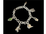Load image into Gallery viewer, Gardening Charm bracelet. Handmade sterling silver chain with six charms. Trowel, seed packet,flowerpot, wheel barrel , watering can and a gemstone leaf.
