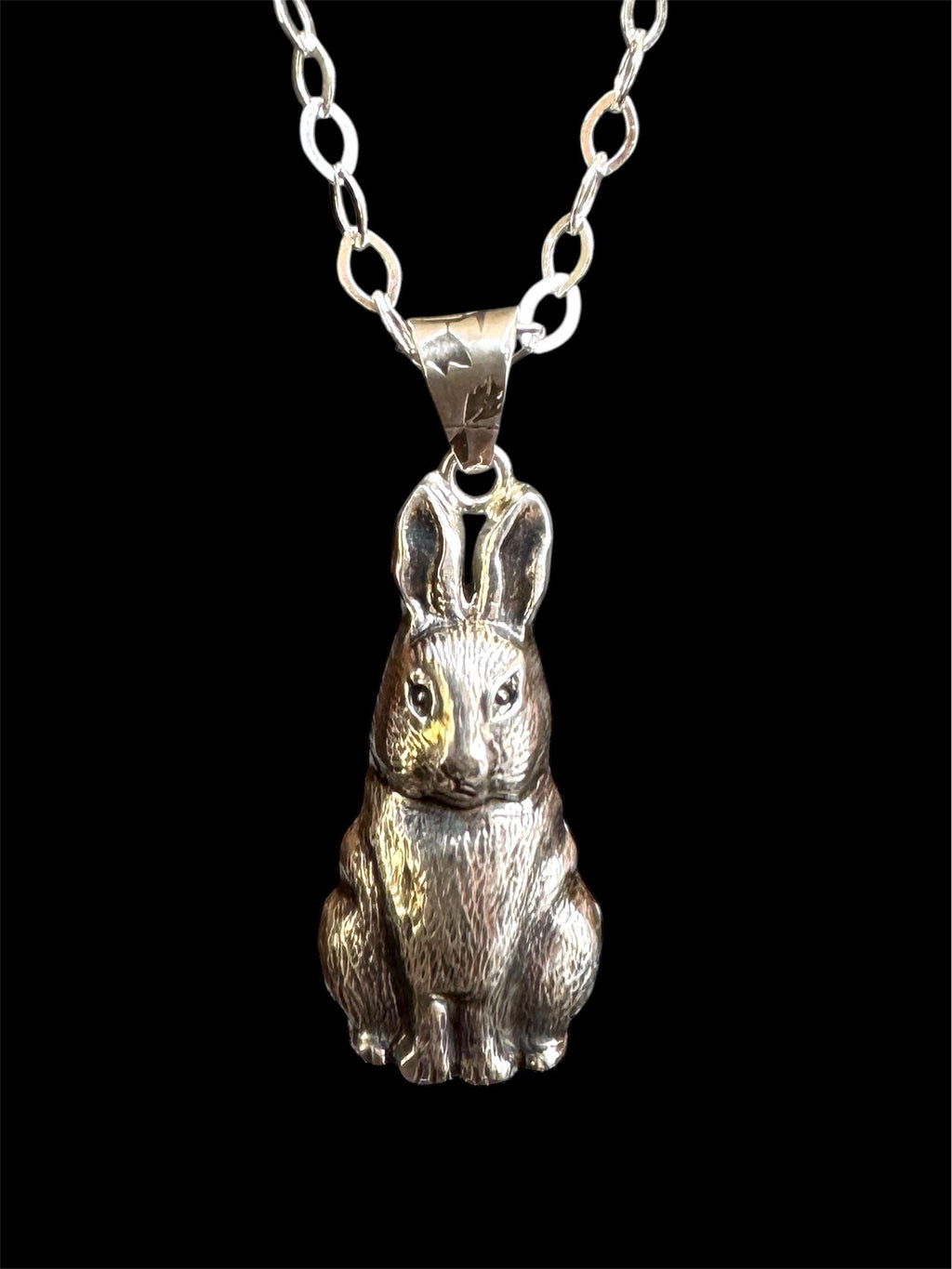 Rabbit pendant in sterling silver created using a vintage jewelry die.