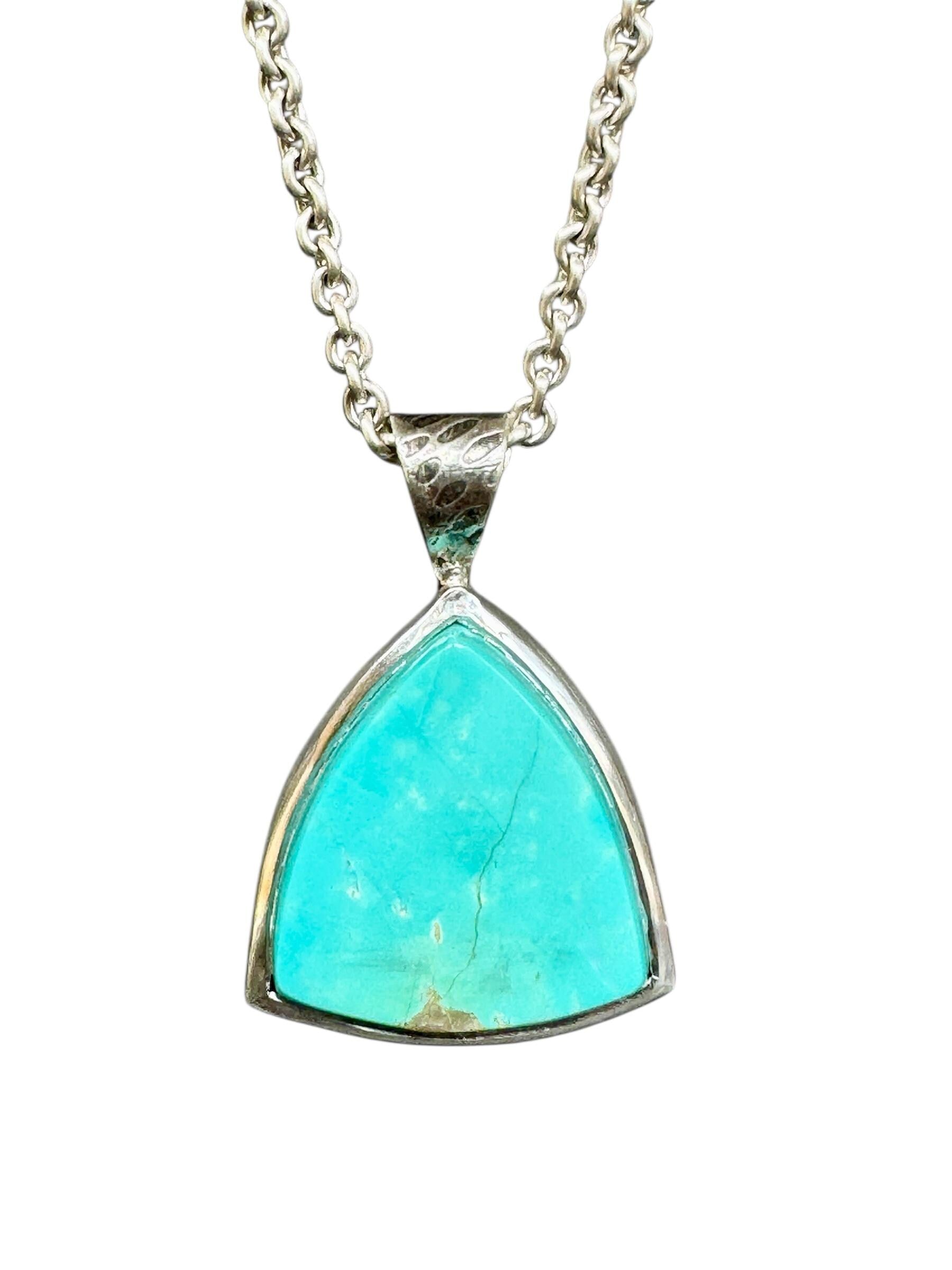 Royston Turquoise pendant. hand carved in a triangle shape and set in sterling silver.