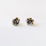 Load image into Gallery viewer, May include: A pair of silver rose flower stud earrings. The earrings are small and delicate, with a realistic rose design.
