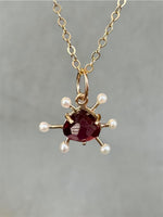 Load image into Gallery viewer, Atomic Rhodolite Garnet and Pearl 10K gold charm, solid gold
