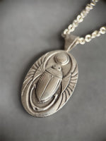 Load image into Gallery viewer, Egyptian Revival Scarab Beetle pendant in sterling silver, vintage die , art deco, hieroglyphics
