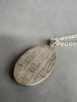 Load image into Gallery viewer, Egyptian Revival Scarab Beetle pendant in sterling silver, vintage die , art deco, hieroglyphics
