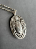 Load image into Gallery viewer, Egyptian Revival Scarab Beetle pendant in sterling silver, vintage die , art deco, hieroglyphics
