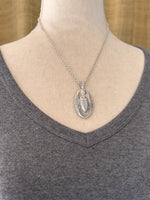 Load image into Gallery viewer, Egyptian Revival Scarab Beetle pendant in sterling silver, vintage die , art deco, hieroglyphics
