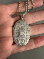 Load image into Gallery viewer, Egyptian Revival Scarab Beetle pendant in sterling silver, vintage die , art deco, hieroglyphics
