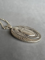 Load image into Gallery viewer, Egyptian Revival Scarab Beetle pendant in sterling silver, vintage die , art deco, hieroglyphics
