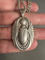 Load image into Gallery viewer, Egyptian Revival Scarab Beetle pendant in sterling silver, vintage die , art deco, hieroglyphics
