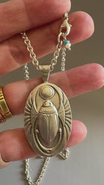 Load and play video in Gallery viewer, Egyptian Revival Scarab Beetle pendant in sterling silver, vintage die , art deco, hieroglyphics
