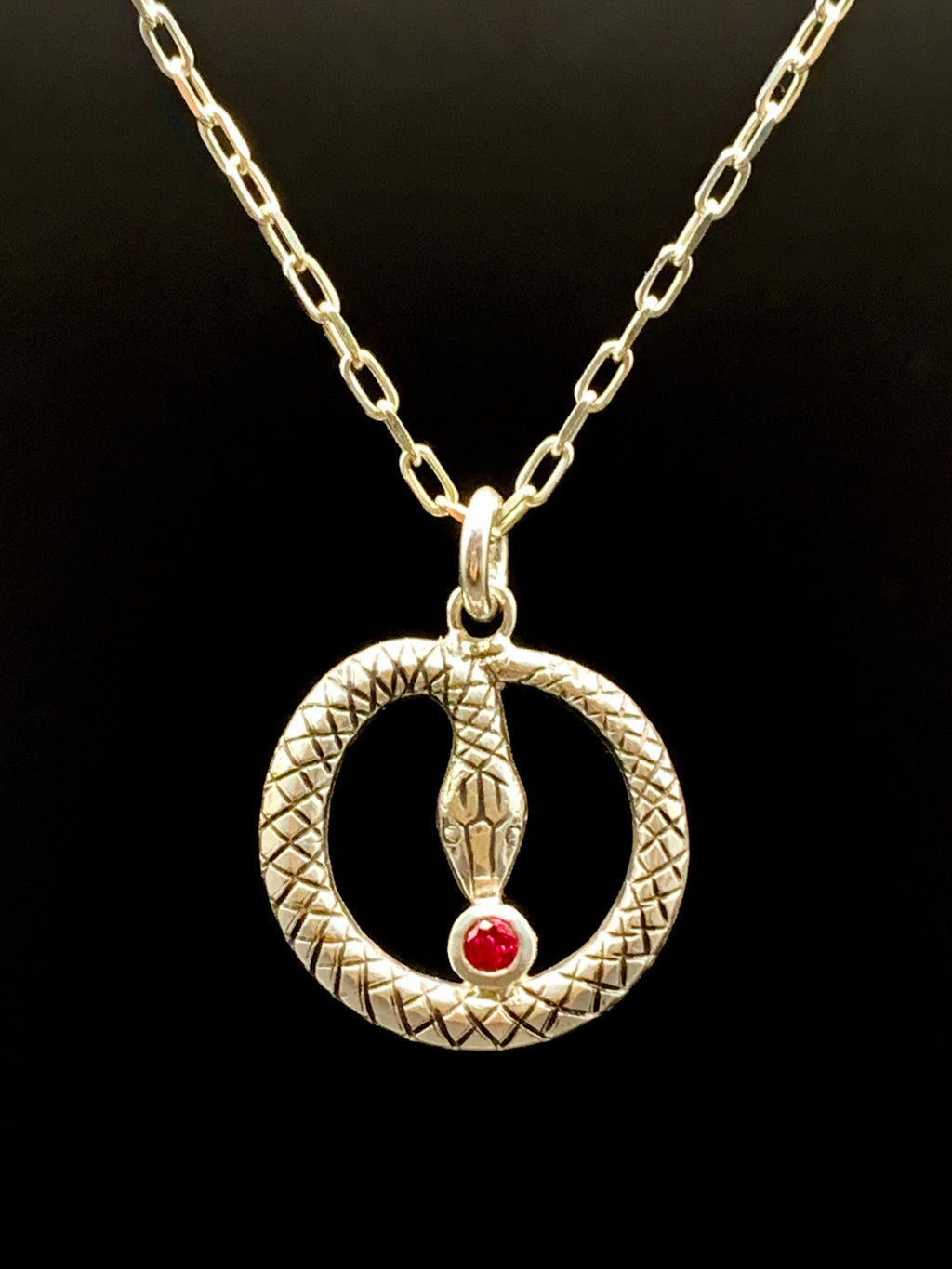 Snake pendant with lab ruby in sterling silver