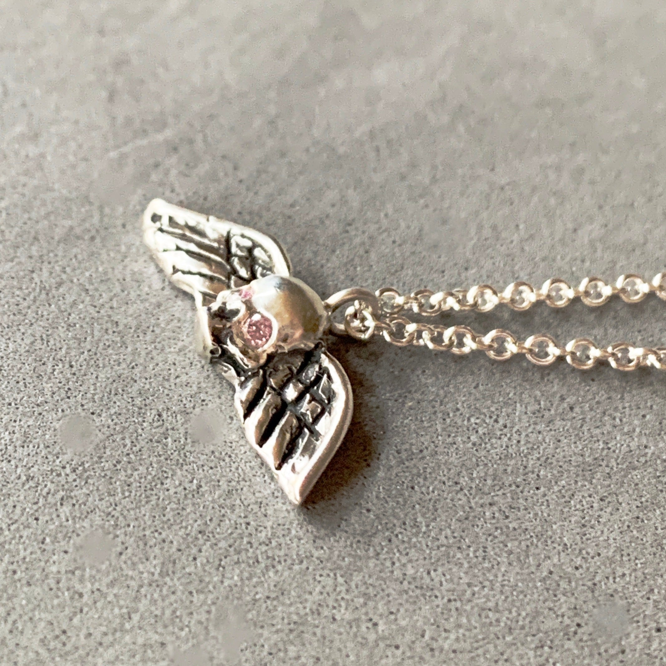 Tiny Winged Skull with Pink Diamonds